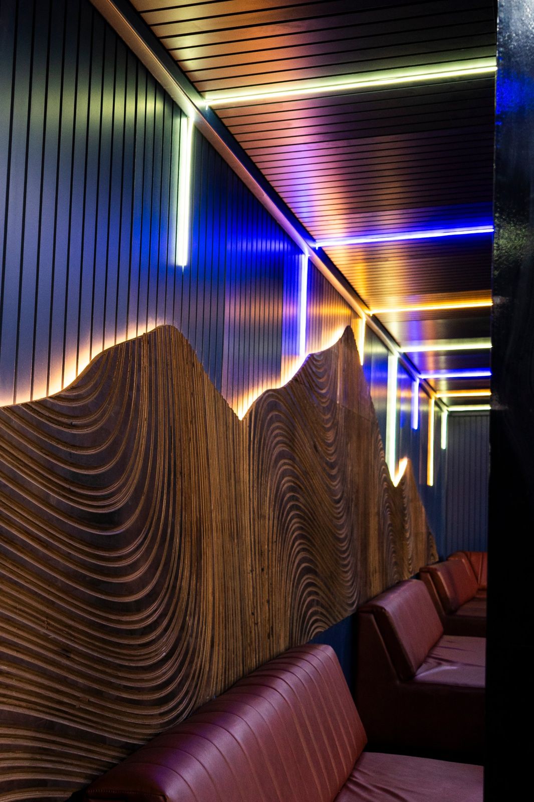 Mountain wall running along the booths